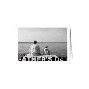 Fathers Day Young Boy and Father Sitting on Edge of Dock Looking Out 