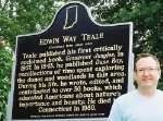 Trent D. Pendley in front of an Indiana Historic Marker honoring 