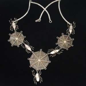 Super cool necklace made up of five spiders and their webs. Bezel set 