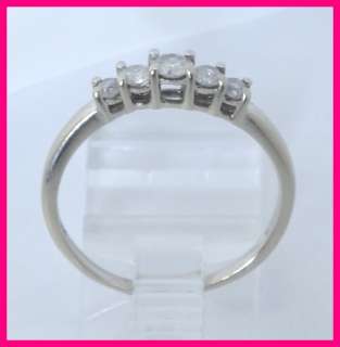   gold diamond anniversary ring the ring has 1 round cut diamond that