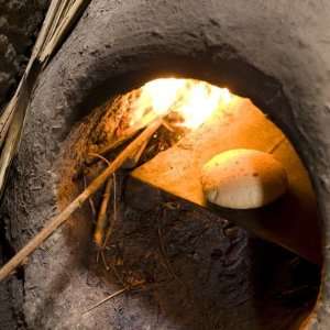 Freshly Baked Bread in a Traditional Communal Clay Oven in the Town of 