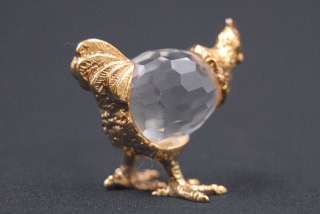 plate and crystal figurine is a hen. She has an egg shaped cut crystal 
