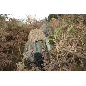  A British Army sniper team dressed in ghillie suits. by 